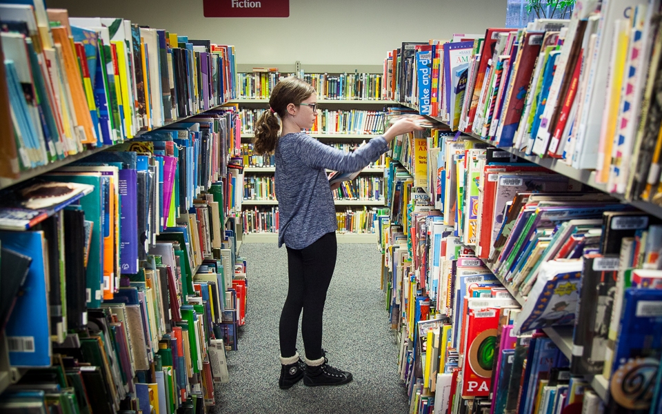 Girl selecting a book